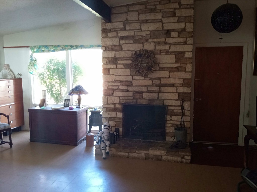 905 Neans Drive Austin, TX 78758 - Photo 19 of 40 a living room with furniture and a fireplace