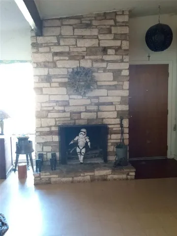 a view of a livingroom with furniture and a window