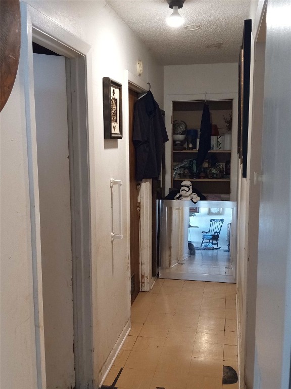 905 Neans Drive Austin, TX 78758 - Photo 29 of 40 a view of a hallway with wooden shelves