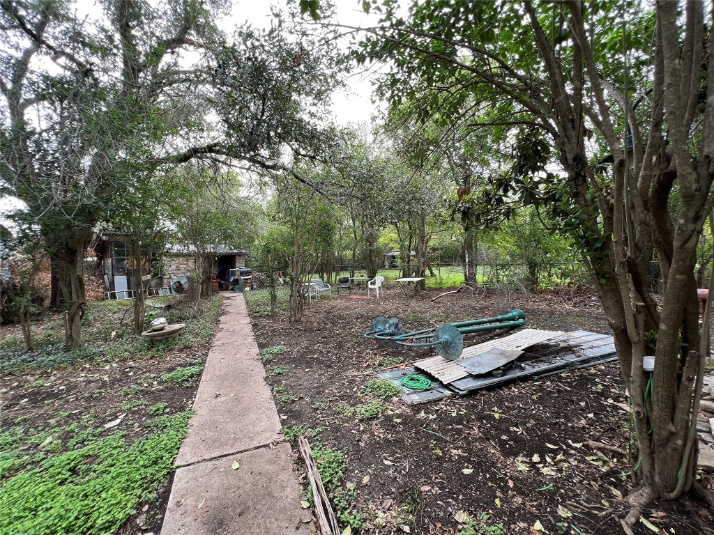 905 Neans Drive Austin, TX 78758 - Photo 3 of 40 a front view of a house with a yard