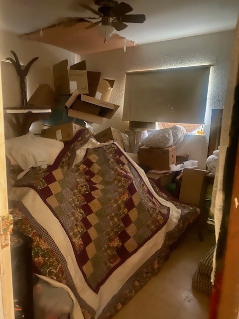 905 Neans Drive Austin, TX 78758 - Photo 31 of 40 a bed sitting in a room next to a window