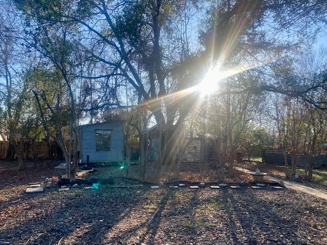 905 Neans Drive Austin, TX 78758 - Photo 33 of 40 a backyard of a house with lots of green space