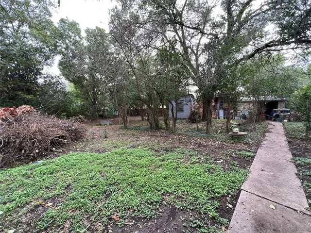 a view of outdoor space with deck and tree