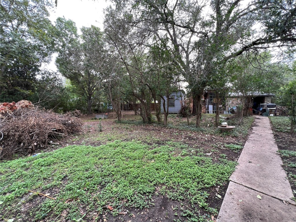 905 Neans Drive Austin, TX 78758 - Photo 4 of 40 a view of outdoor space with deck and tree