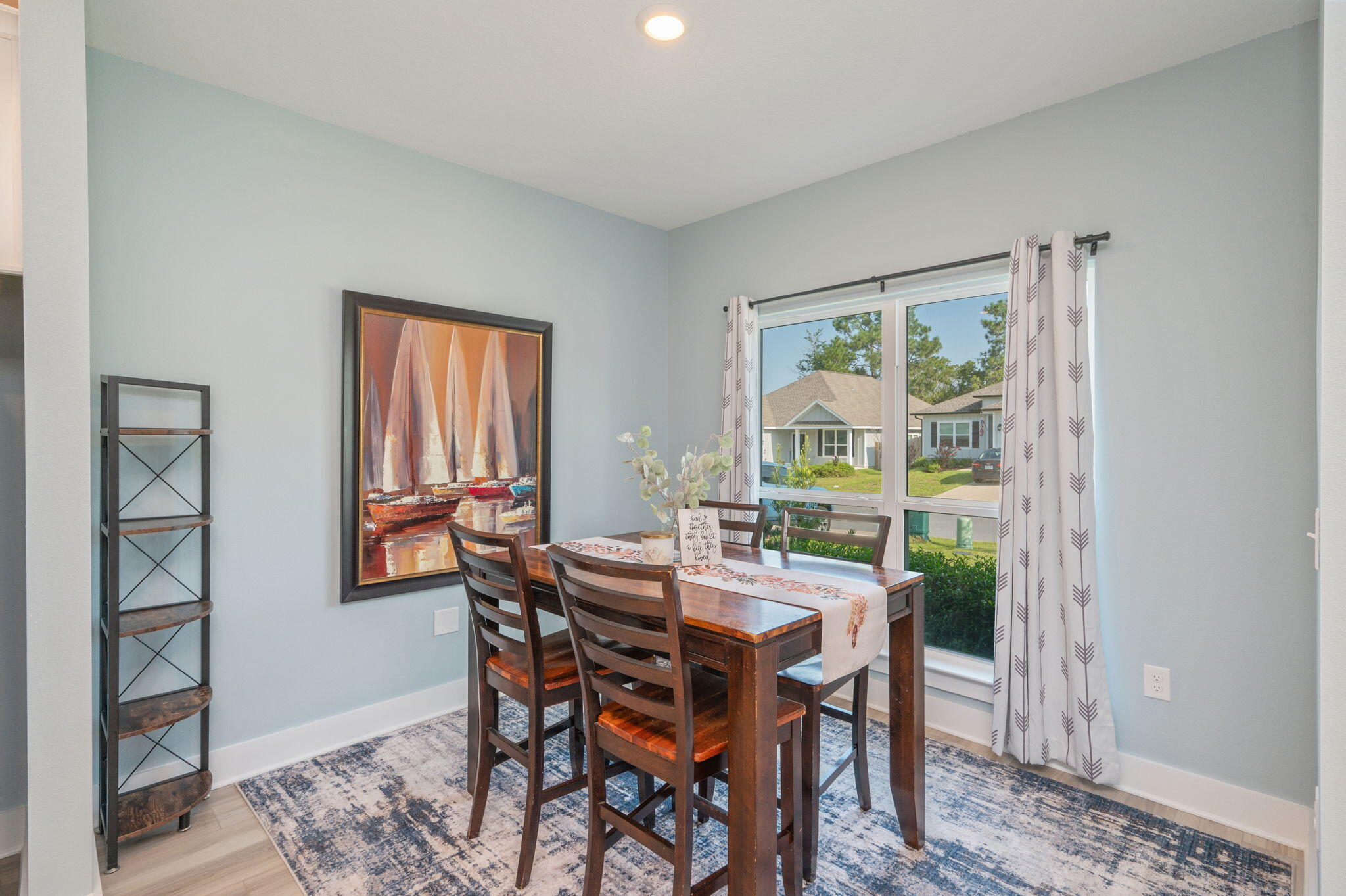 109 Blooming Cove Crestview, FL 32539 - Photo 17 of 42 a view of a dining room with furniture window and wooden floor
