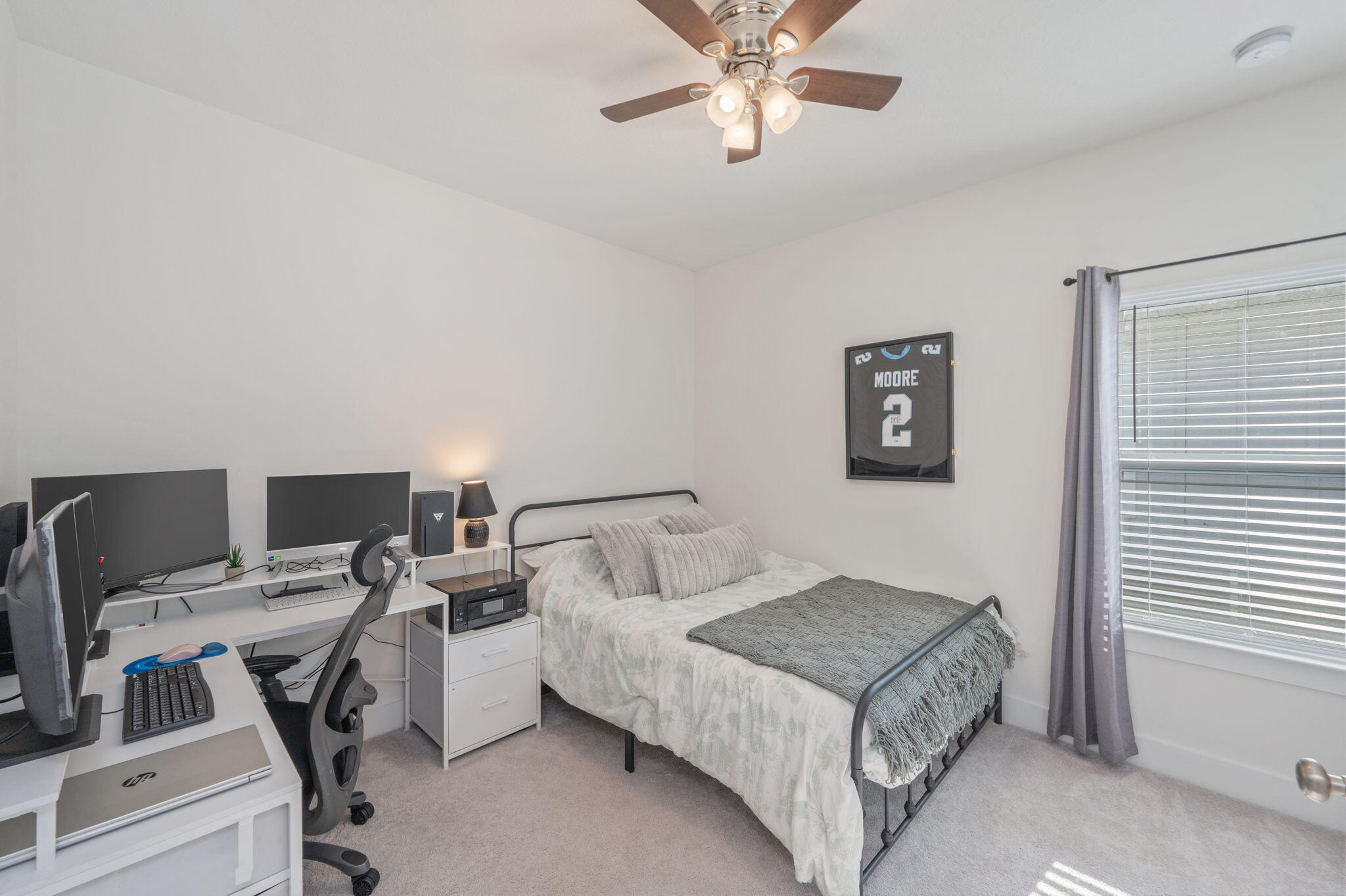 109 Blooming Cove Crestview, FL 32539 - Photo 18 of 42 a bedroom with a bed and a desk