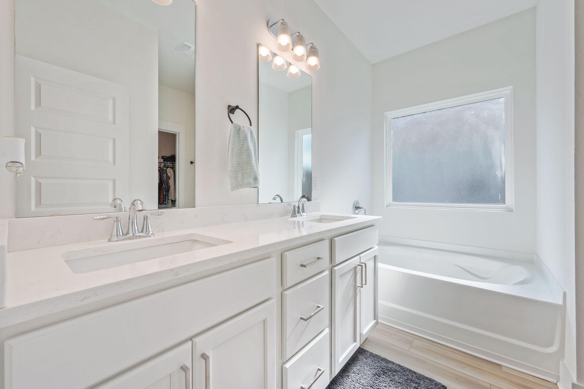 109 Blooming Cove Crestview, FL 32539 - Photo 31 of 42 a bathroom with a sink double vanity granite tub and a mirror