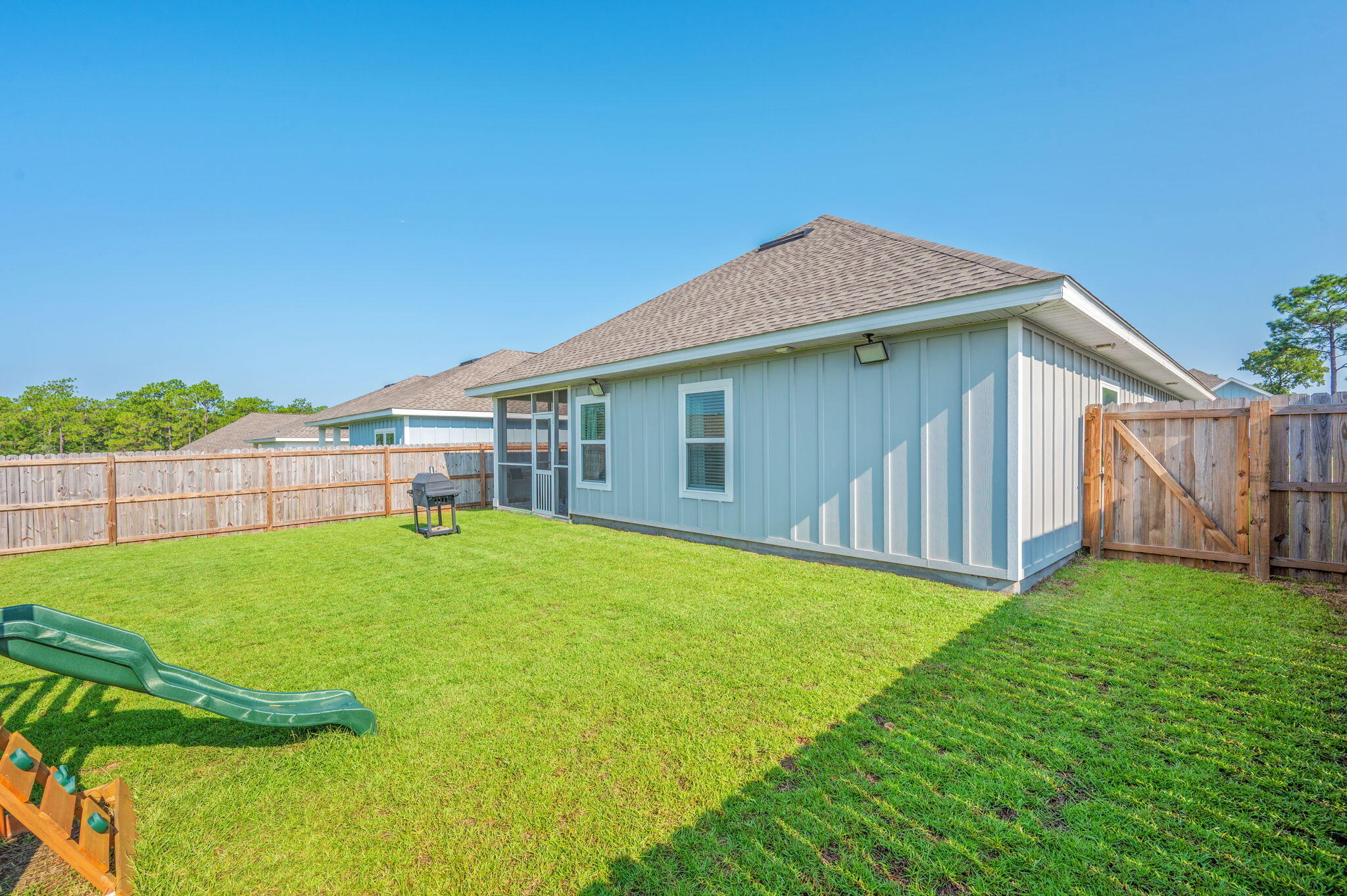 109 Blooming Cove Crestview, FL 32539 - Photo 39 of 42 a backyard of a house with lots of green space