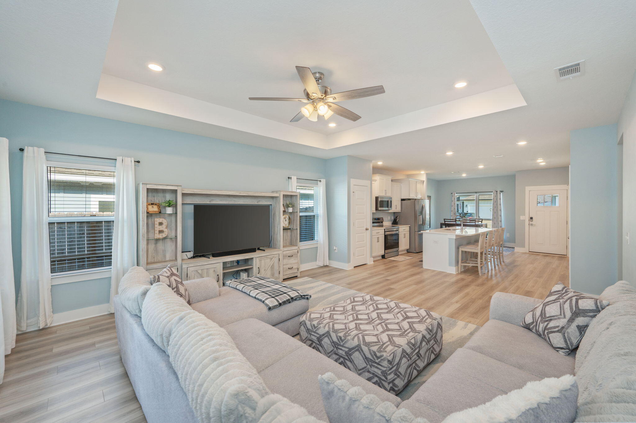 109 Blooming Cove Crestview, FL 32539 - Photo 9 of 42 a living room with furniture flat screen tv and a chandelier