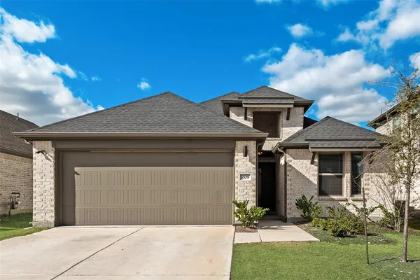 a front view of a house with yard