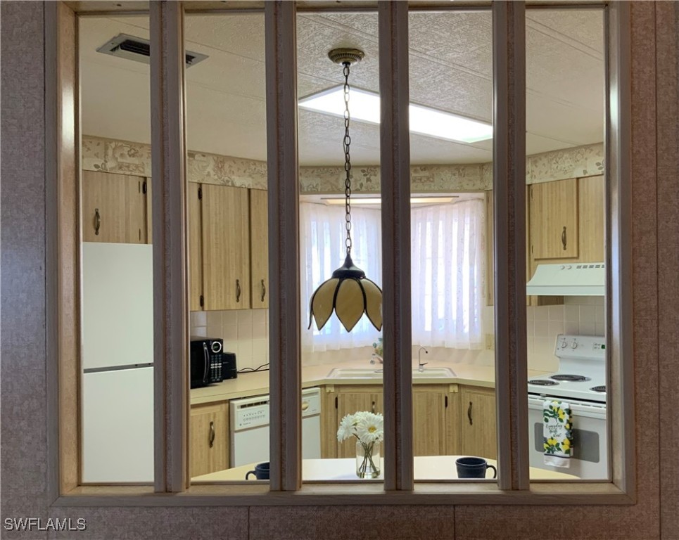 15550 Burnt Store Road, Unit 188 Punta Gorda, FL 33955 - Photo 14 of 37 a bathroom with a glass door and a window