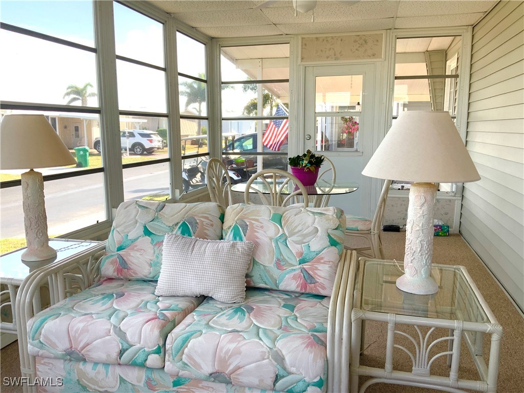15550 Burnt Store Road, Unit 188 Punta Gorda, FL 33955 - Photo 18 of 37 a living room with furniture and a large window