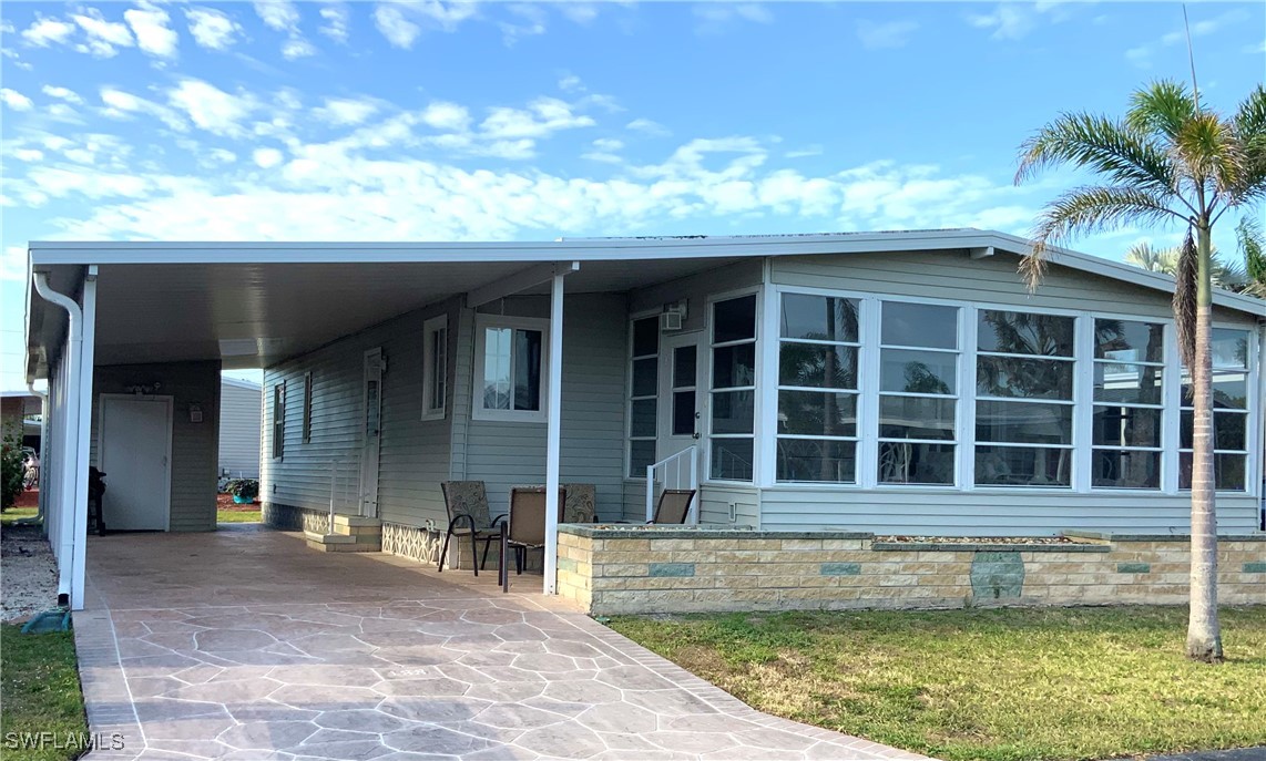 15550 Burnt Store Road, Unit 188 Punta Gorda, FL 33955 - Photo 2 of 37 a view of a house with a swimming pool