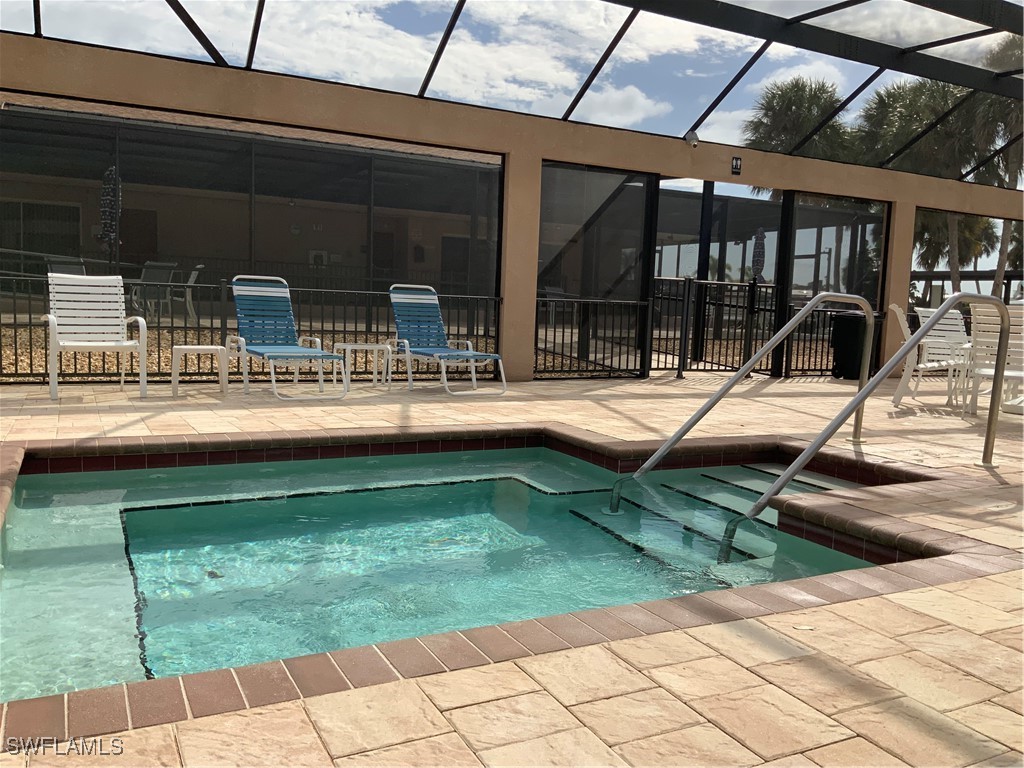 15550 Burnt Store Road, Unit 188 Punta Gorda, FL 33955 - Photo 34 of 37 a swimming pool with outdoor seating and patio