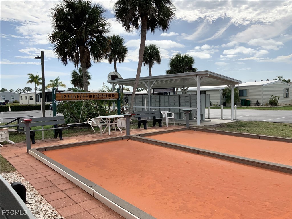 15550 Burnt Store Road, Unit 188 Punta Gorda, FL 33955 - Photo 37 of 37 a view of a swimming pool with a patio and a garden