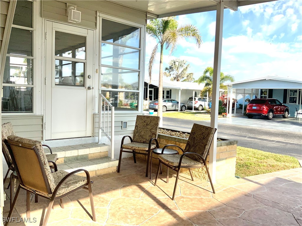 15550 Burnt Store Road, Unit 188 Punta Gorda, FL 33955 - Photo 4 of 37 a view of a swimming pool with outdoor seating