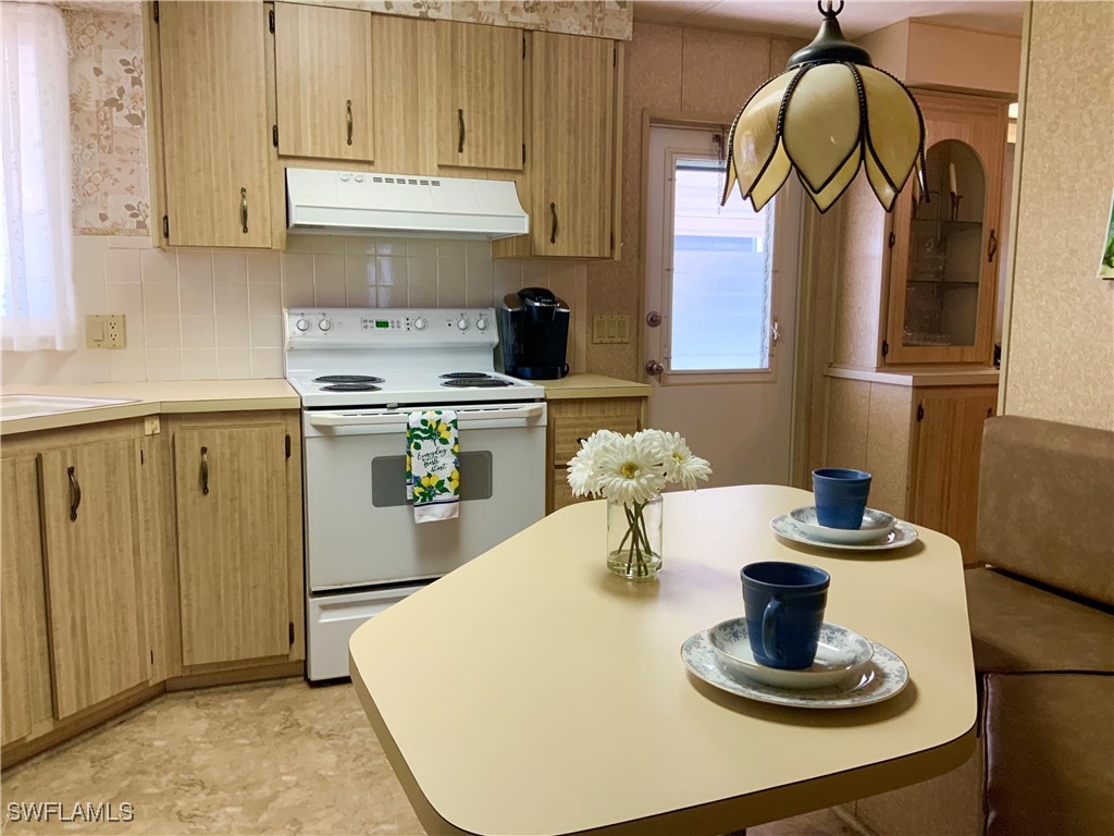 15550 Burnt Store Road, Unit 188 Punta Gorda, FL 33955 - Photo 10 of 37 a kitchen with a sink and a stove