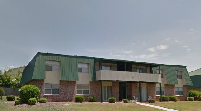 103 Apache Drive Other, AL 36330 - Photo 6 of 8 a front view of a building with a garden