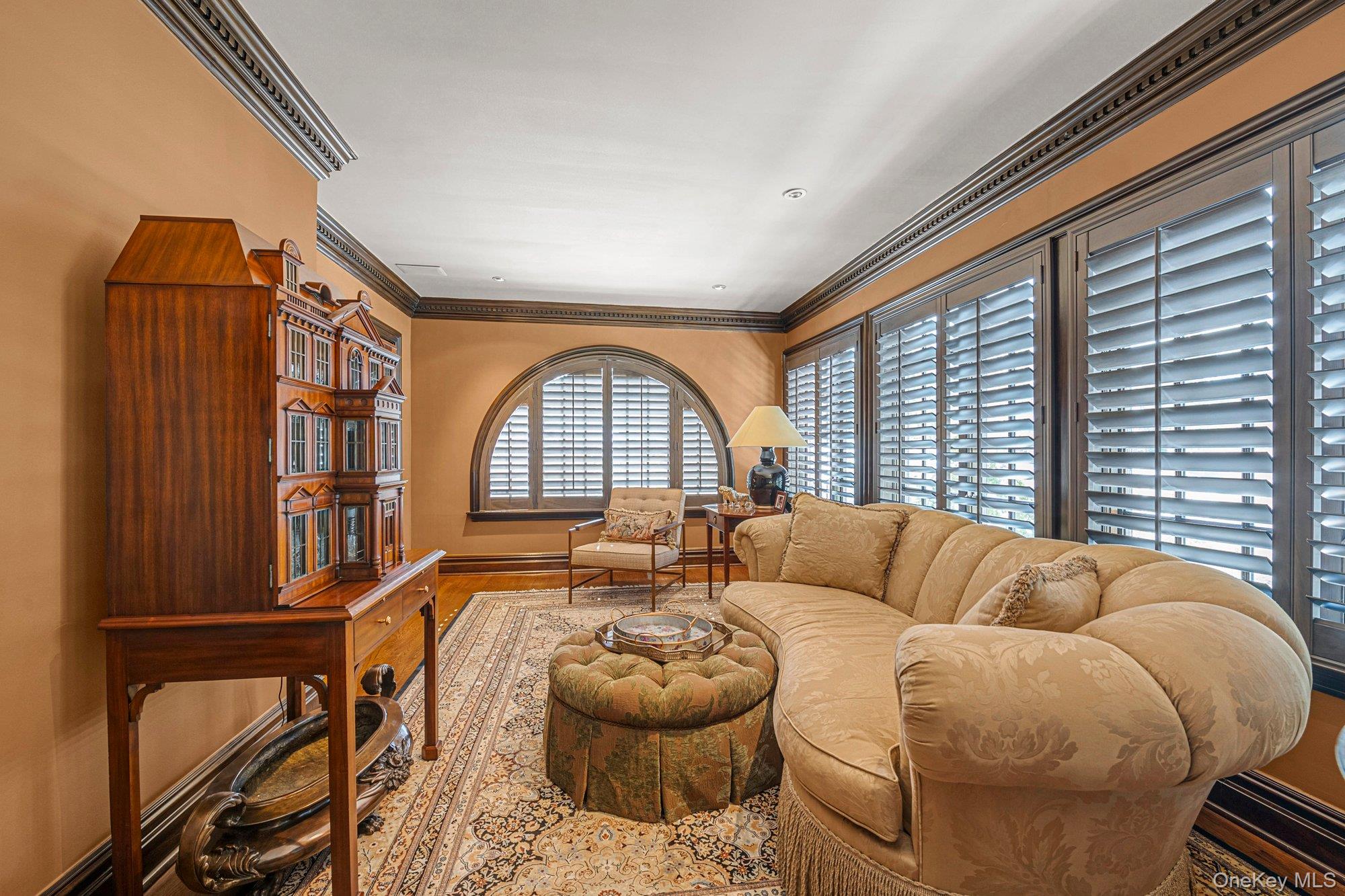 183 Mill Spring Road Manhasset, NY 11030 - Photo 15 of 32 Cozy sitting room adorned with wood interior shutters