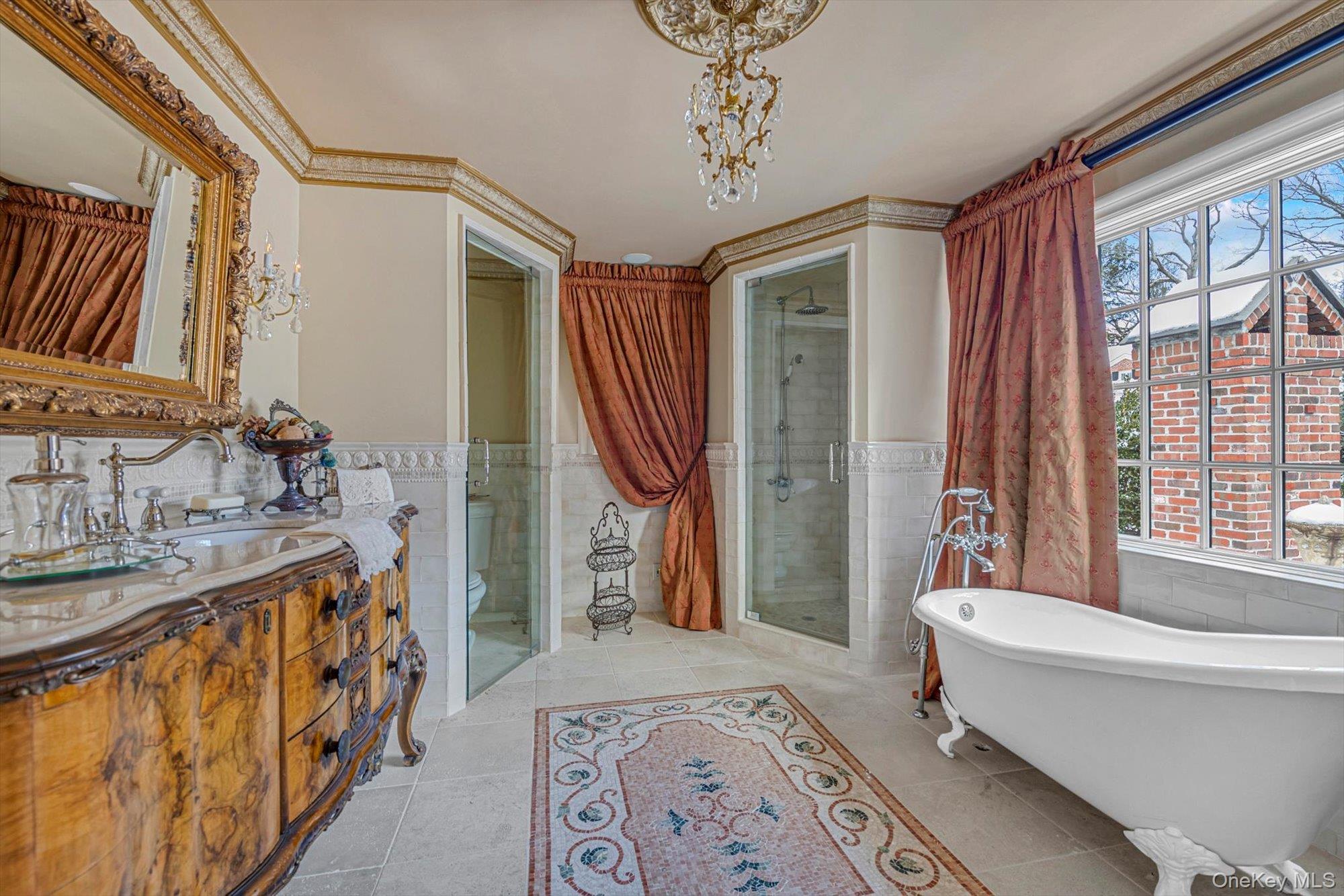 183 Mill Spring Road Manhasset, NY 11030 - Photo 18 of 32 Spa-like primary bathroom with soaking tub, shower closet, elegant vanity and radiant heated floors, with marble inlay designs.