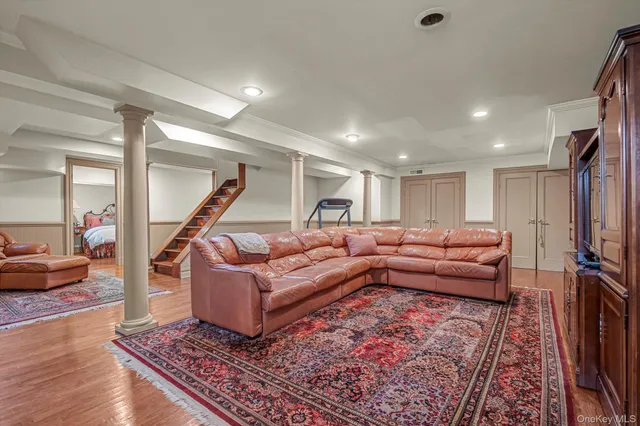 a living room with furniture and a rug