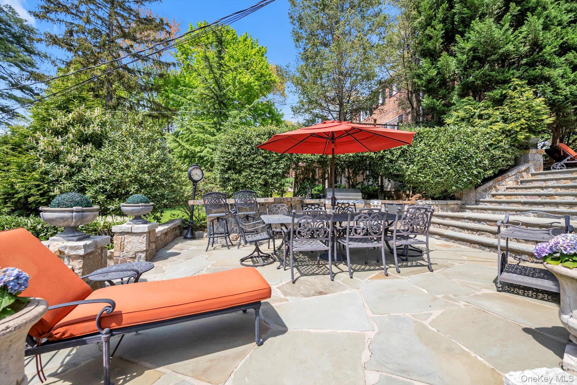 183 Mill Spring Road Manhasset, NY 11030 - Photo 27 of 32 View of patio / terrace featuring outdoor dining space and custom stone built in BBQ and stone banquet area