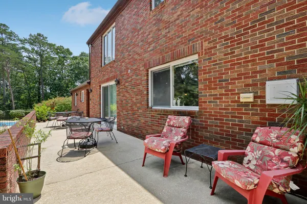 a kitchen with stainless steel appliances granite countertop a refrigerator and a stove