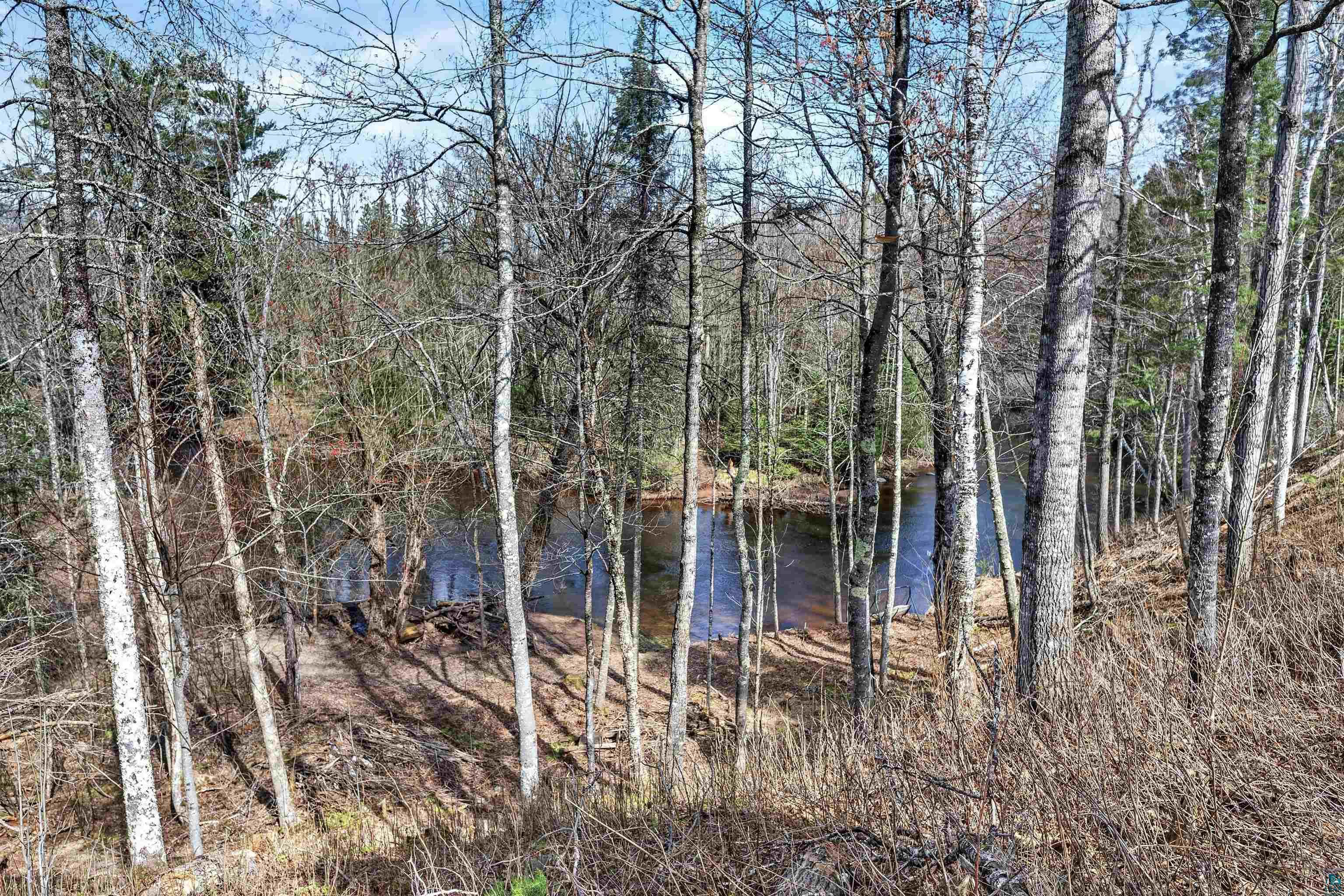 13885 Park Road Brule, WI 54820 - Photo 39 of 41 Natural water feature surrounded by mature trees and varied foliage