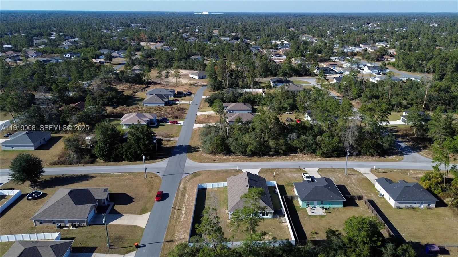 0 Southwest 167th Loop Ocala, FL 34473 - Photo 30 of 31 an aerial view of residential houses with outdoor space and parking