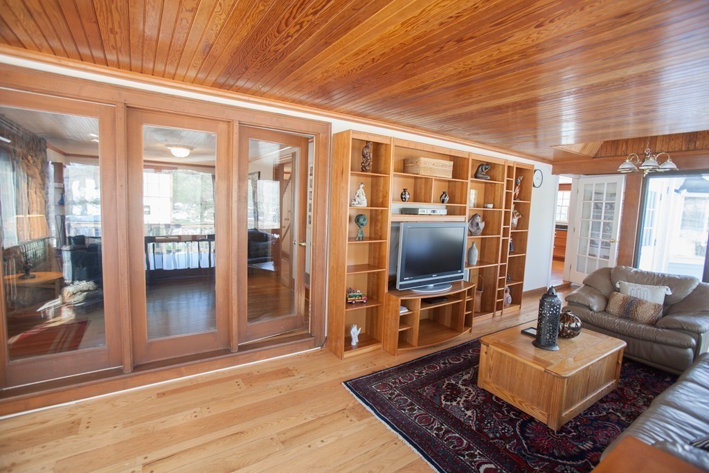 10 Wildon Road Wellesley, MA 02482 - Photo 14 of 15 a living room with furniture and a flat screen tv