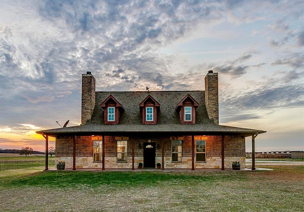 2220 Lazy Bend Road Millsap, TX 76066 - Photo 2 of 36 a front view of a house with garden