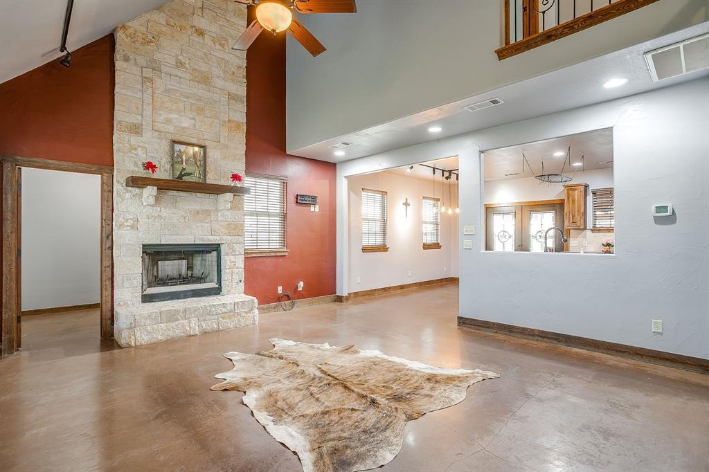 2220 Lazy Bend Road Millsap, TX 76066 - Photo 22 of 36 a view of an empty room with a fireplace