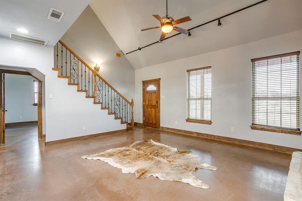 2220 Lazy Bend Road Millsap, TX 76066 - Photo 23 of 36 a view of an empty room with wooden floor and a window
