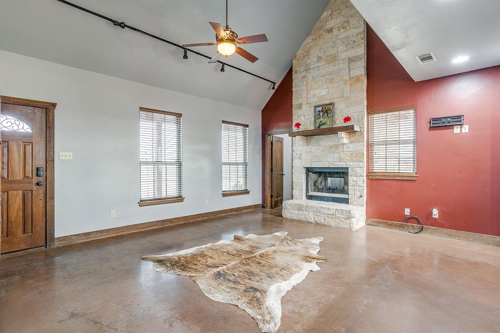 2220 Lazy Bend Road Millsap, TX 76066 - Photo 24 of 36 an empty room with windows and fireplace