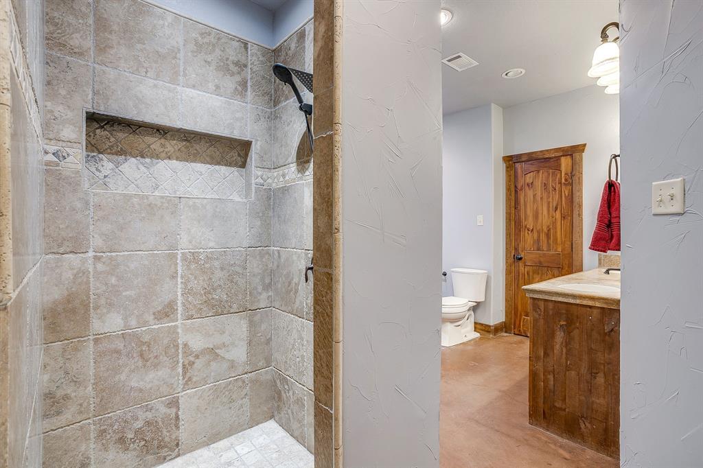 2220 Lazy Bend Road Millsap, TX 76066 - Photo 28 of 36 a bathroom with a shower and a sink