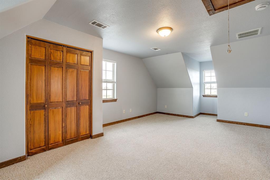 2220 Lazy Bend Road Millsap, TX 76066 - Photo 32 of 36 an empty room with windows