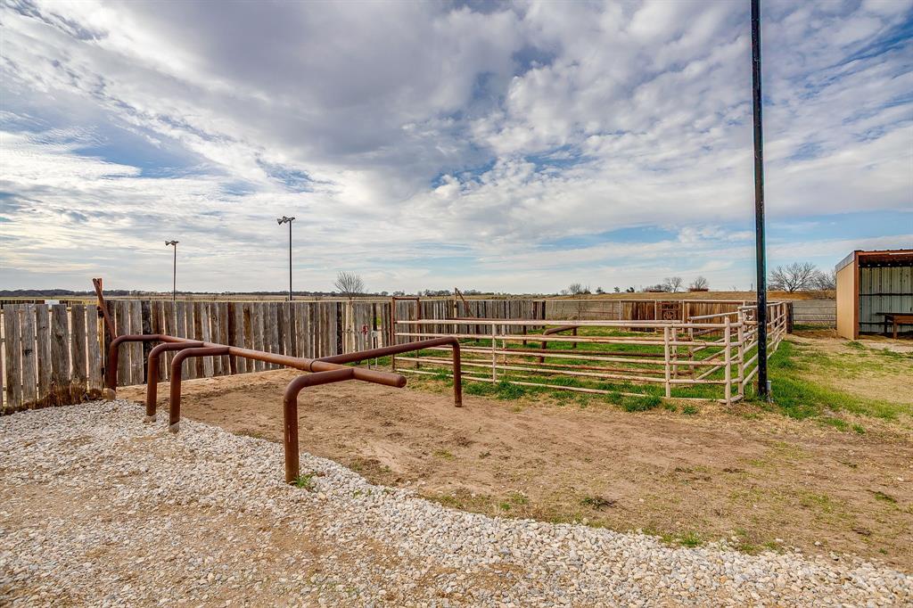 2220 Lazy Bend Road Millsap, TX 76066 - Photo 33 of 36 a view of a bench in a backyard