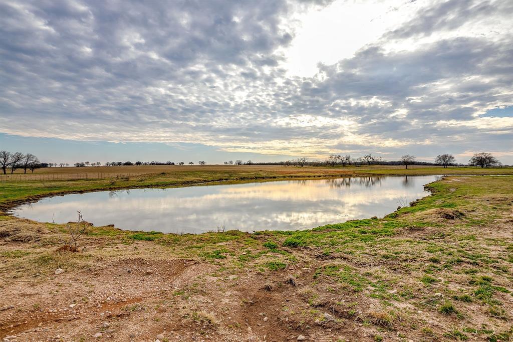 2220 Lazy Bend Road Millsap, TX 76066 - Photo 34 of 36 a view of a lake with houses in the back