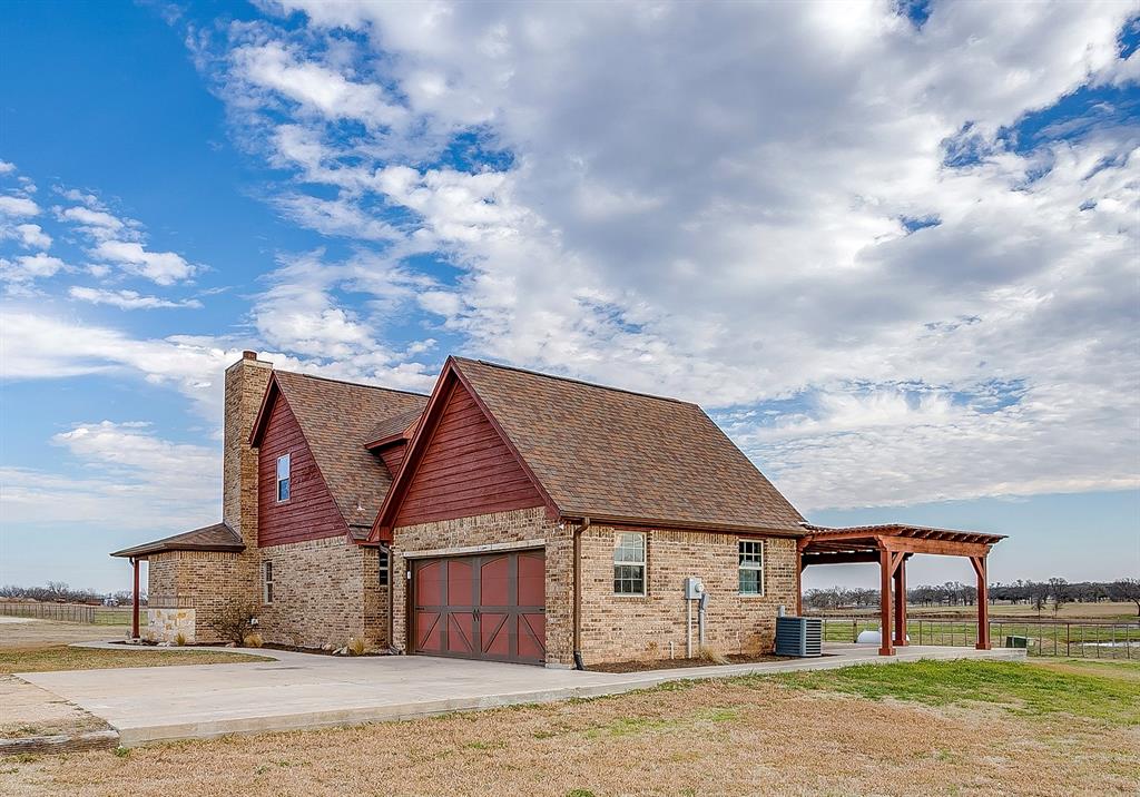 2220 Lazy Bend Road Millsap, TX 76066 - Photo 4 of 36 a view of a big house next to a big yard