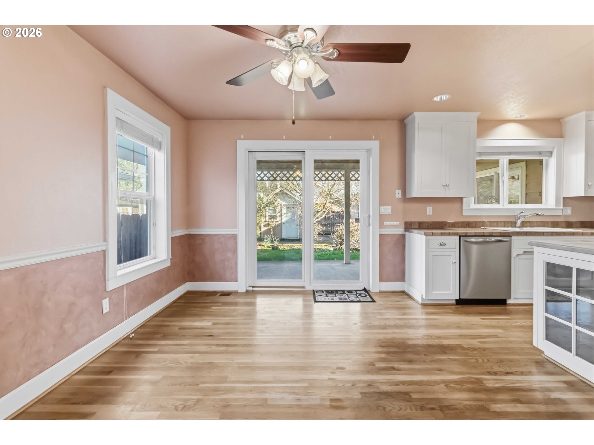 3008 Garfield Street Longview, WA 98632 - Photo 14 of 45 a view of a kitchen with a sink cabinets and wooden floor