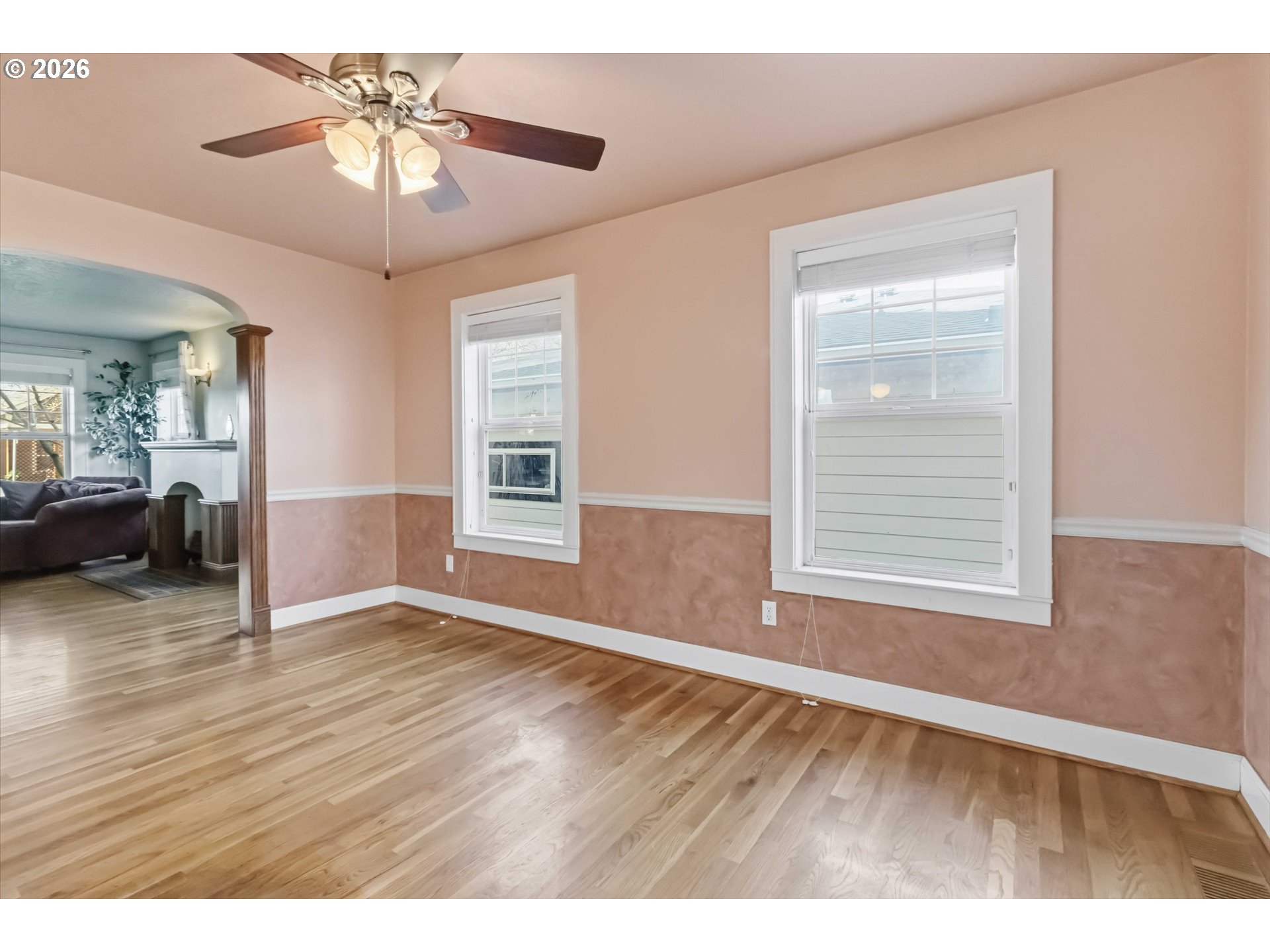 3008 Garfield Street Longview, WA 98632 - Photo 16 of 45 a view of an empty room with a window and wooden floor