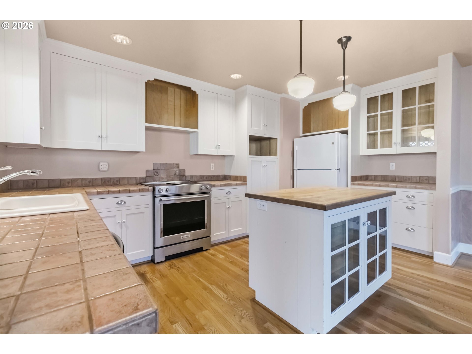3008 Garfield Street Longview, WA 98632 - Photo 21 of 45 a kitchen with stainless steel appliances granite countertop a stove a sink and a microwave