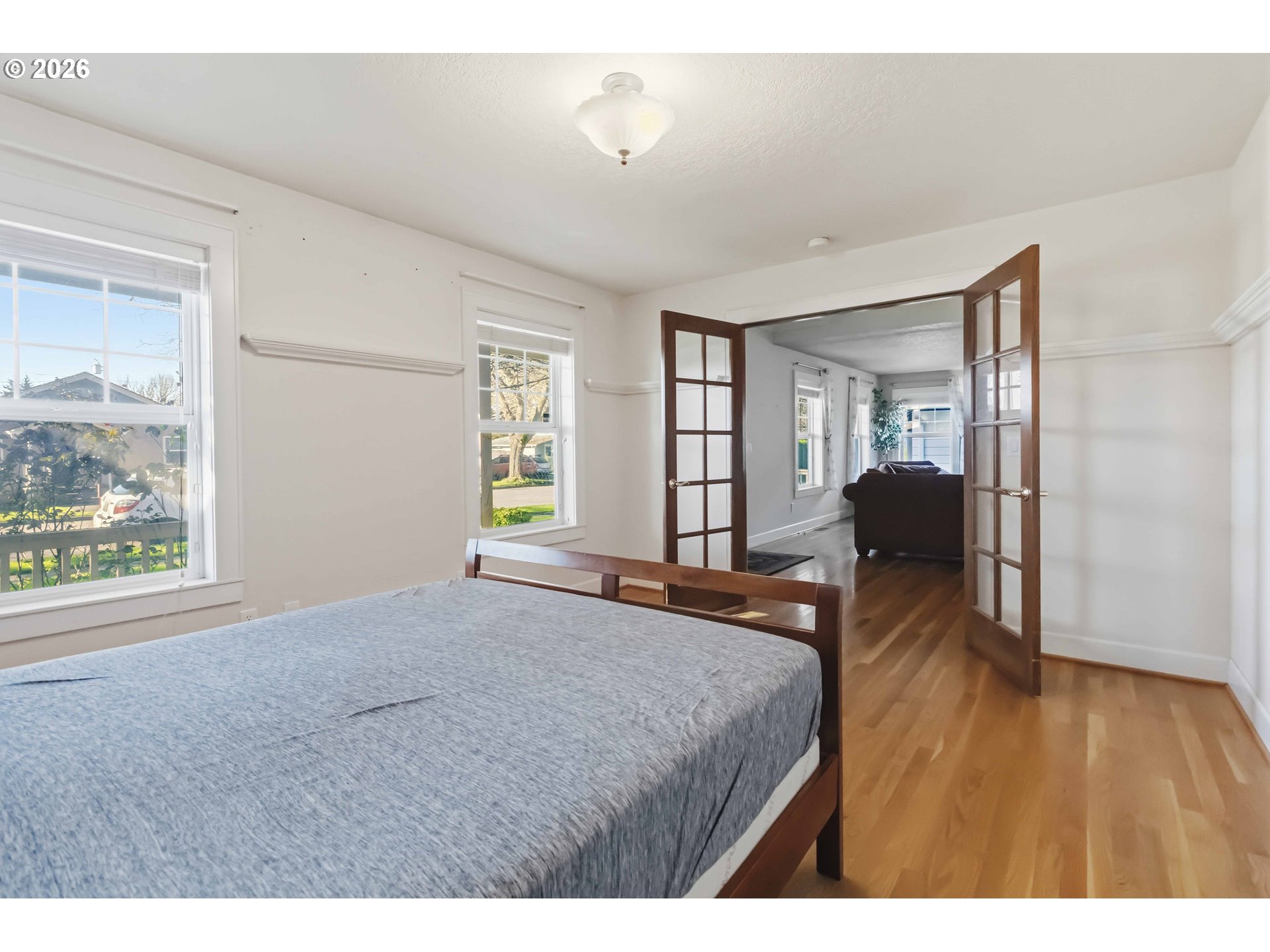 3008 Garfield Street Longview, WA 98632 - Photo 26 of 45 a bedroom with a bed and wooden floor