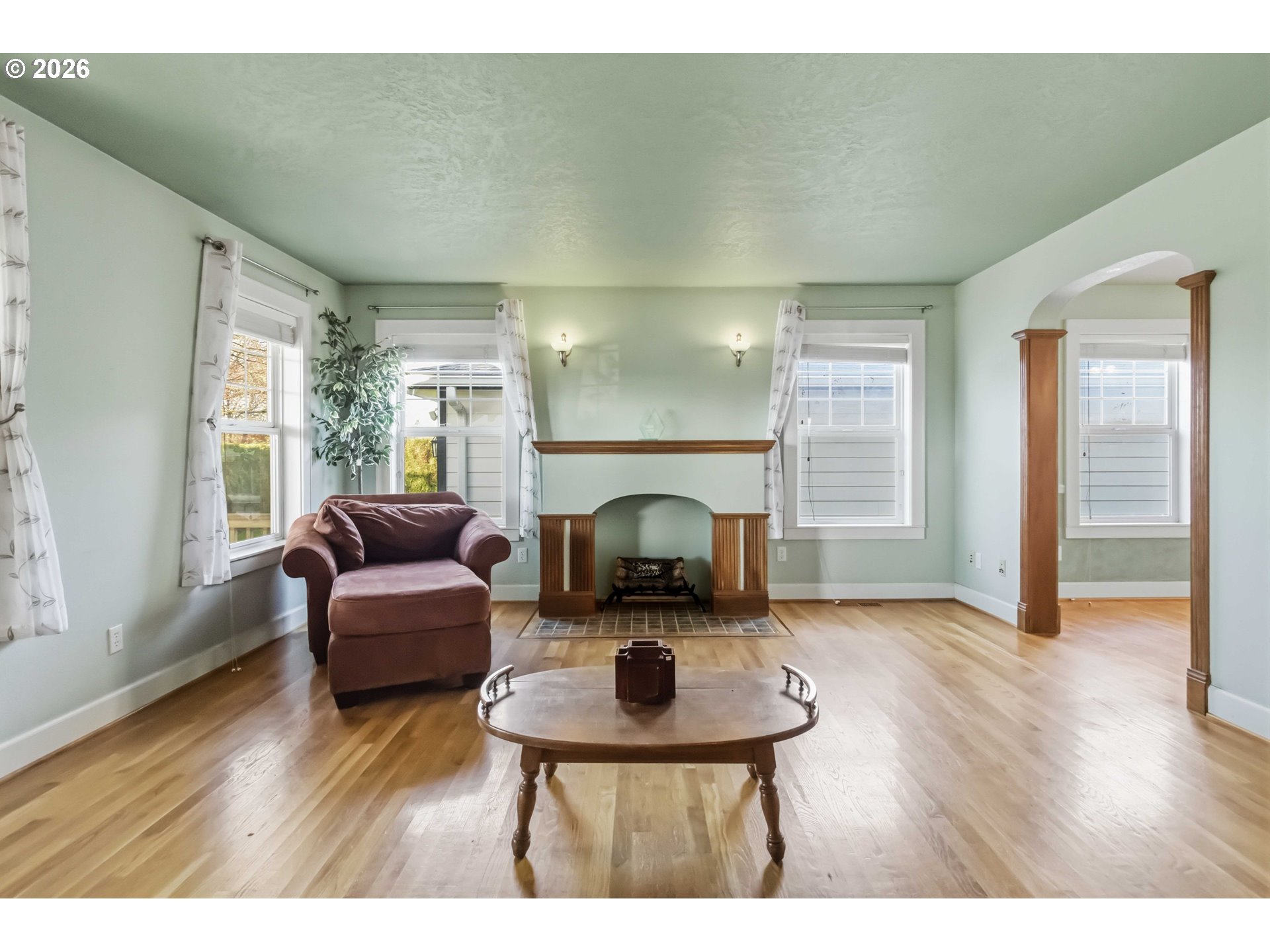 3008 Garfield Street Longview, WA 98632 - Photo 7 of 45 a living room with furniture a fireplace and wooden floor
