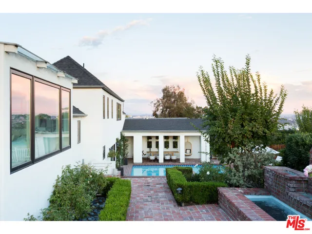 a house view with a garden space