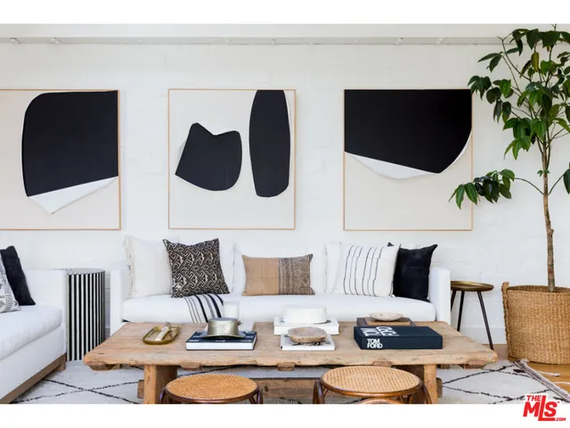 a living room with furniture and flat screen tv