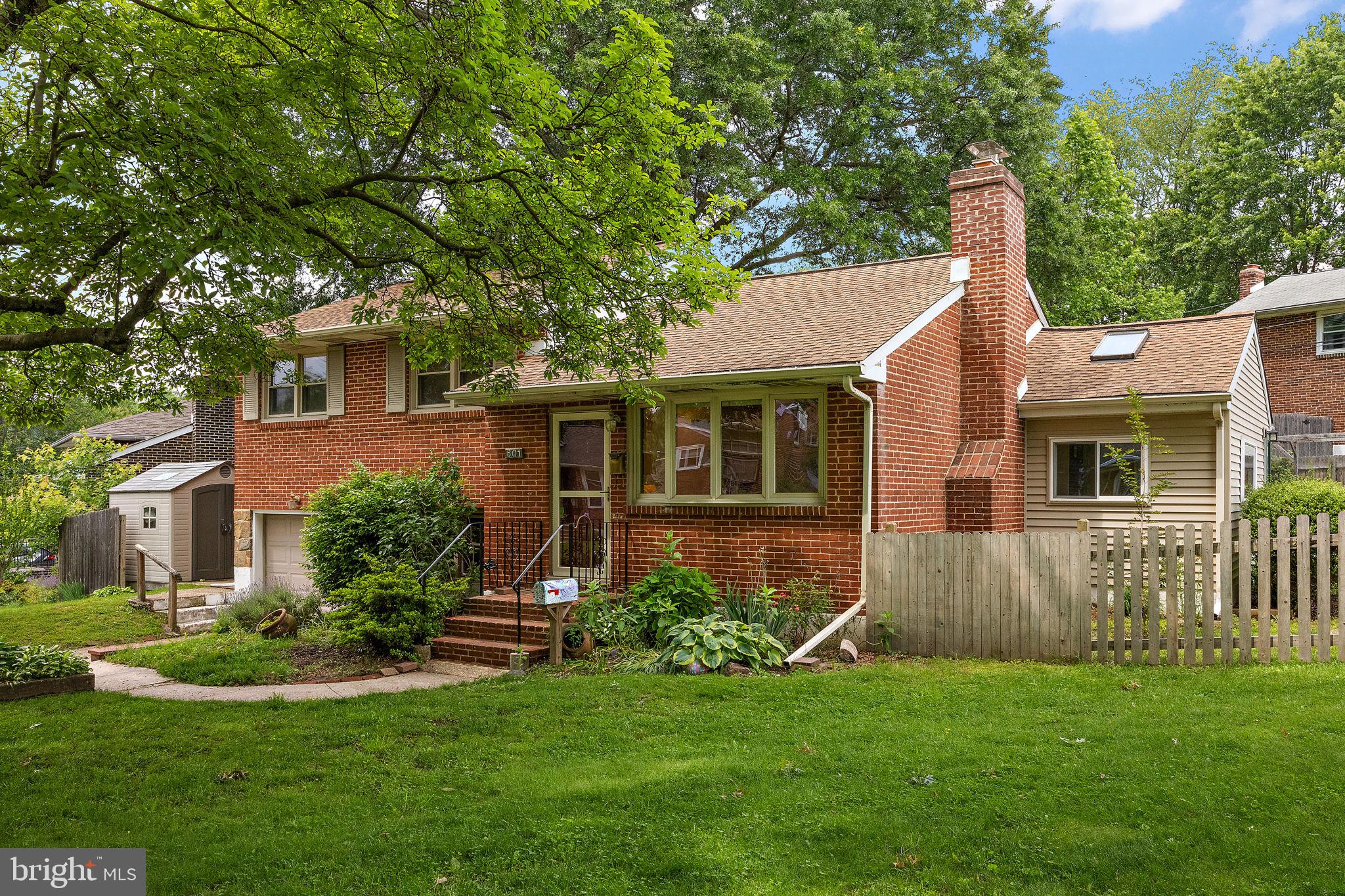 601 Riverview Road Claymont, DE 19703 - Photo 1 of 33 a front view of a house with a garden