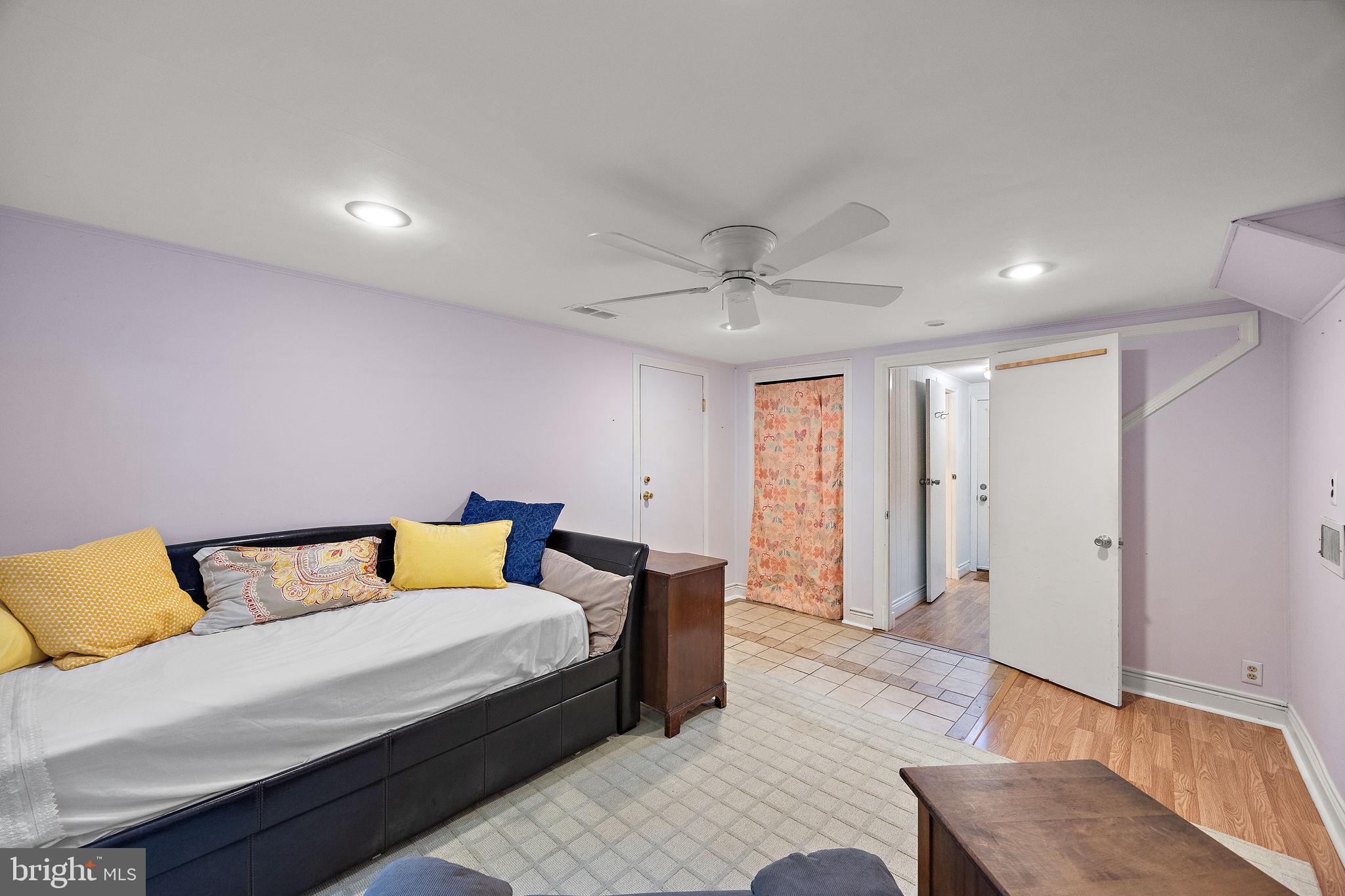 601 Riverview Road Claymont, DE 19703 - Photo 14 of 33 a bedroom with a bed and wooden floor