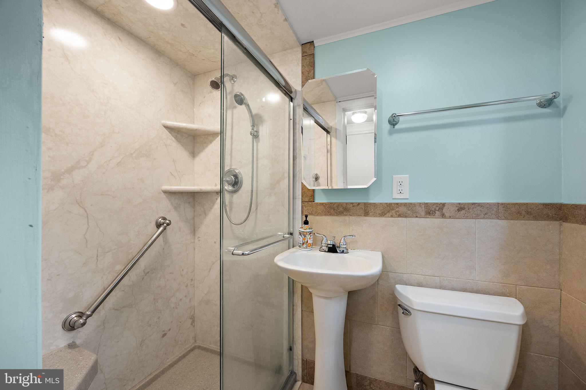 601 Riverview Road Claymont, DE 19703 - Photo 16 of 33 a bathroom with a sink a toilet and shower