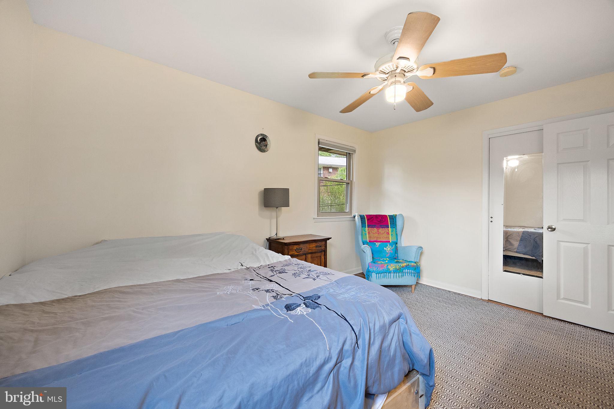 601 Riverview Road Claymont, DE 19703 - Photo 19 of 33 a bedroom with a bed and a chandelier